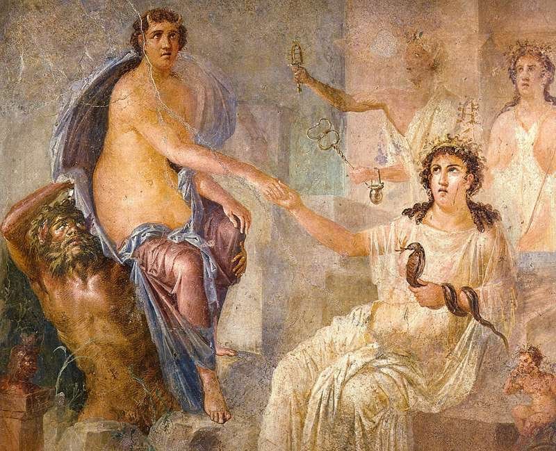 Io, a la izquierda aún con los cuernos de ternera, es recibida en Egipto por la diosa Isis, sentada y sosteniendo una serpiente. Museo Arqueológico Nacional, Nápoles.