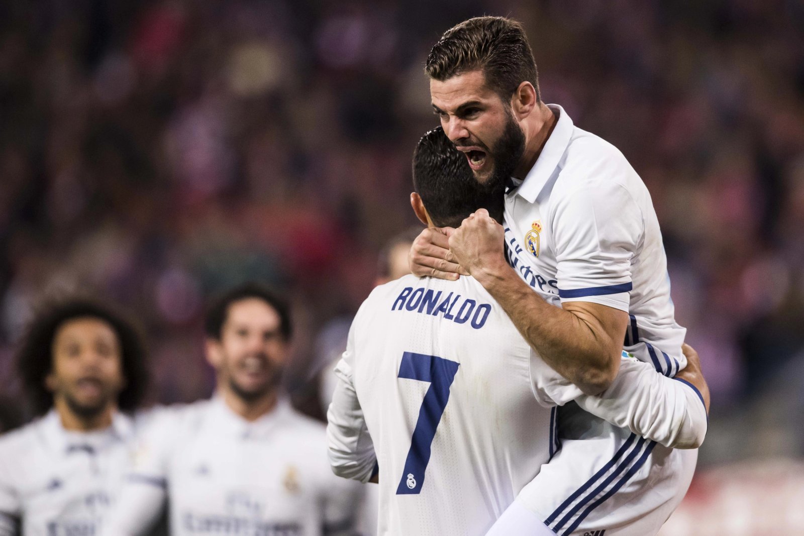 Nacho y Cristiano celebrando un gol en el Real Madrid.